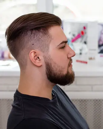 Layered side part styled and blow-dried in the barbershop