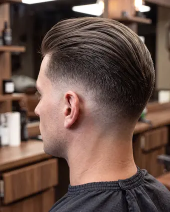 Client with a freshly cut textured crop in the barber chair
