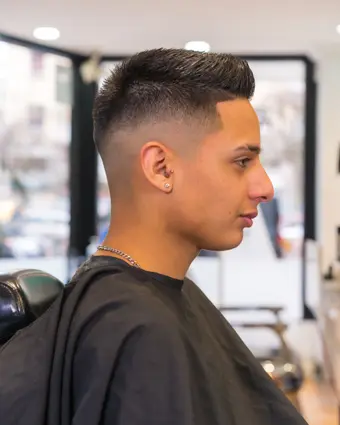Client checking out a finished cut at the end of the appointment
